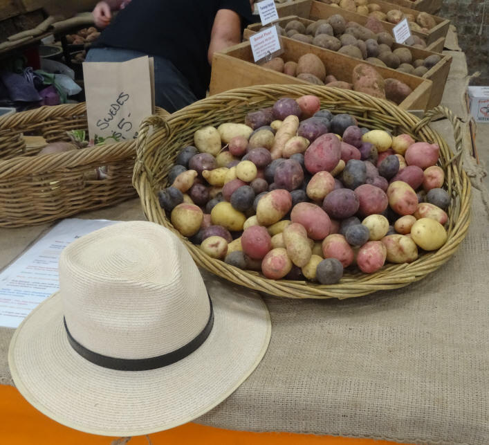 basket of mixed potatoes with white hat